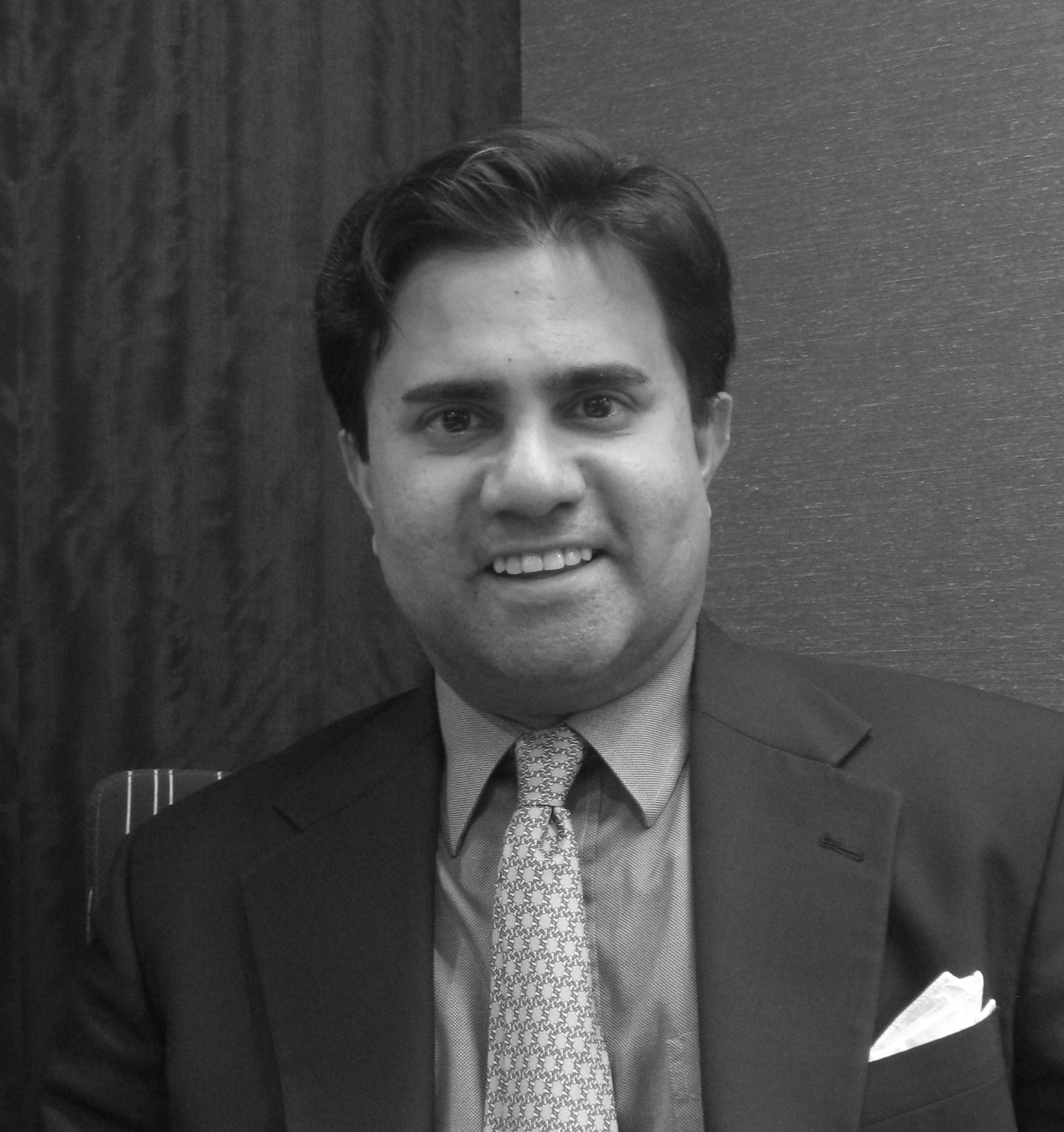 A speaker photo for David Acharya