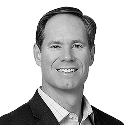 A speaker photo for Greg Carlson