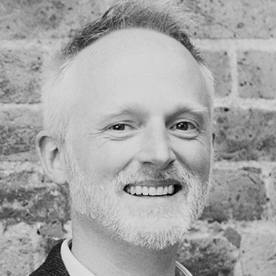 A speaker photo for Daniel Brewer